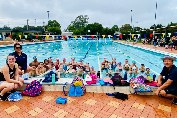 Swimmers racing in lap lanes